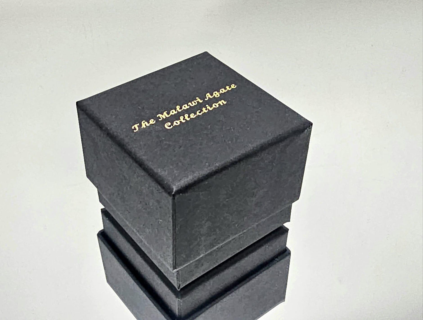 A luxury polished Malawi agate crystal, beautifully boxed for display.