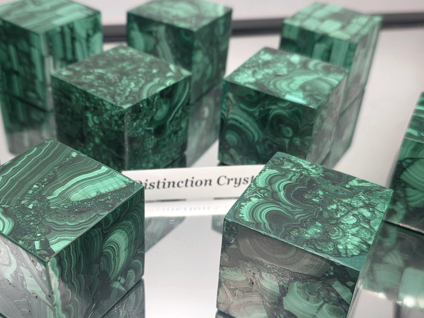 Close-up of Malachite cube highlighting unique natural veining.
