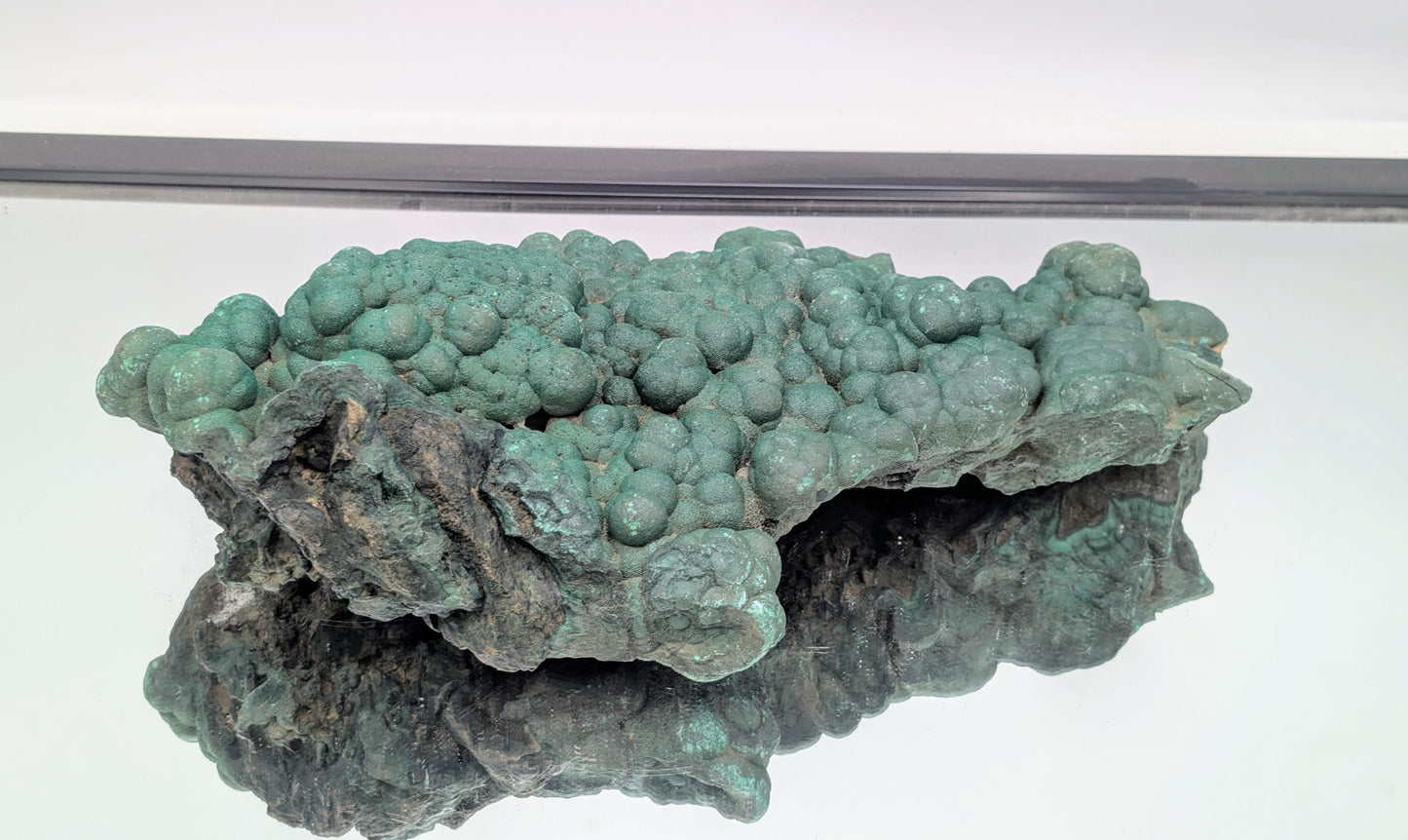 Unique malachite specimen with natural quartz druzy formations.