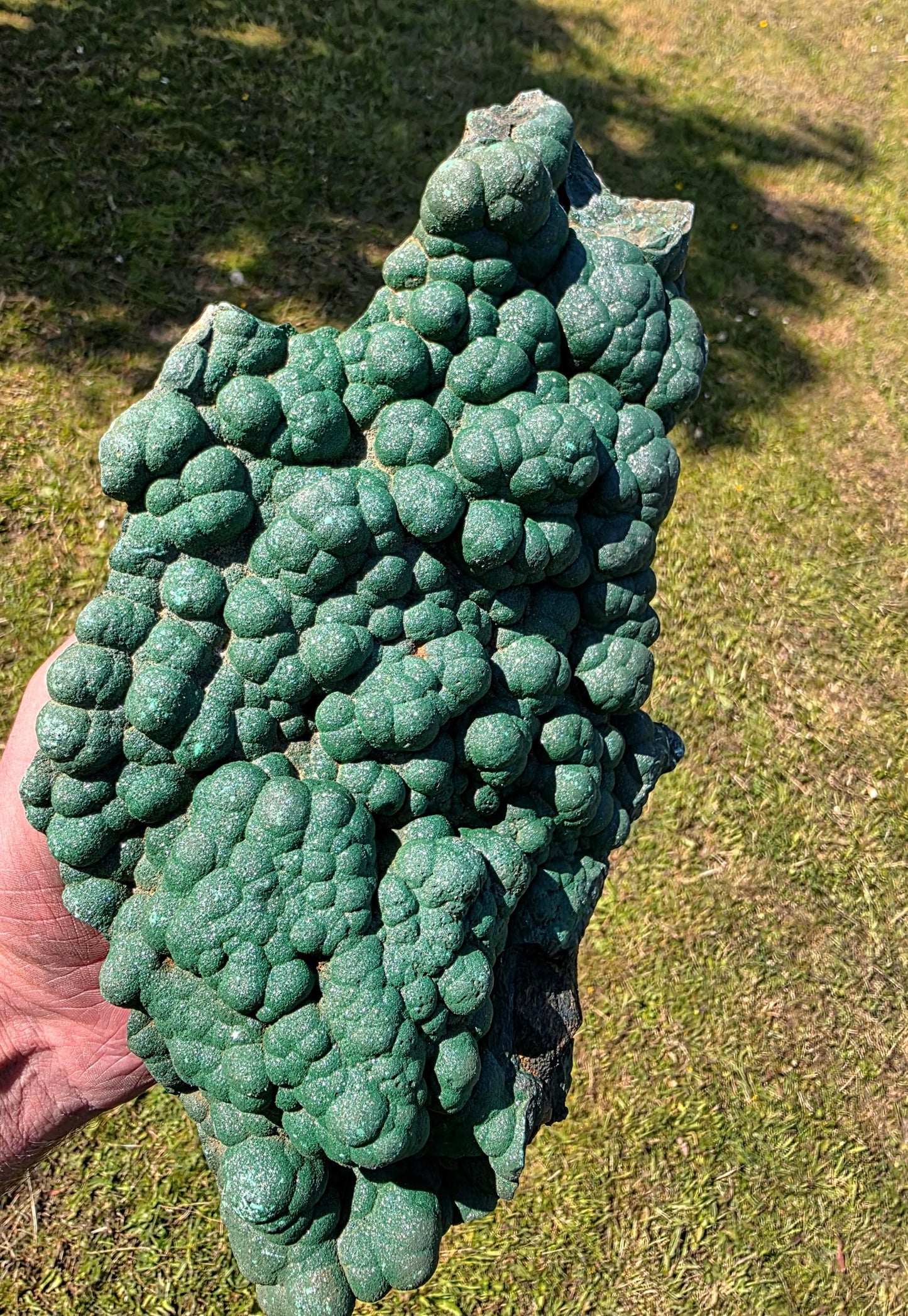 Extra-large malachite specimen featuring quartz druzy crystals.