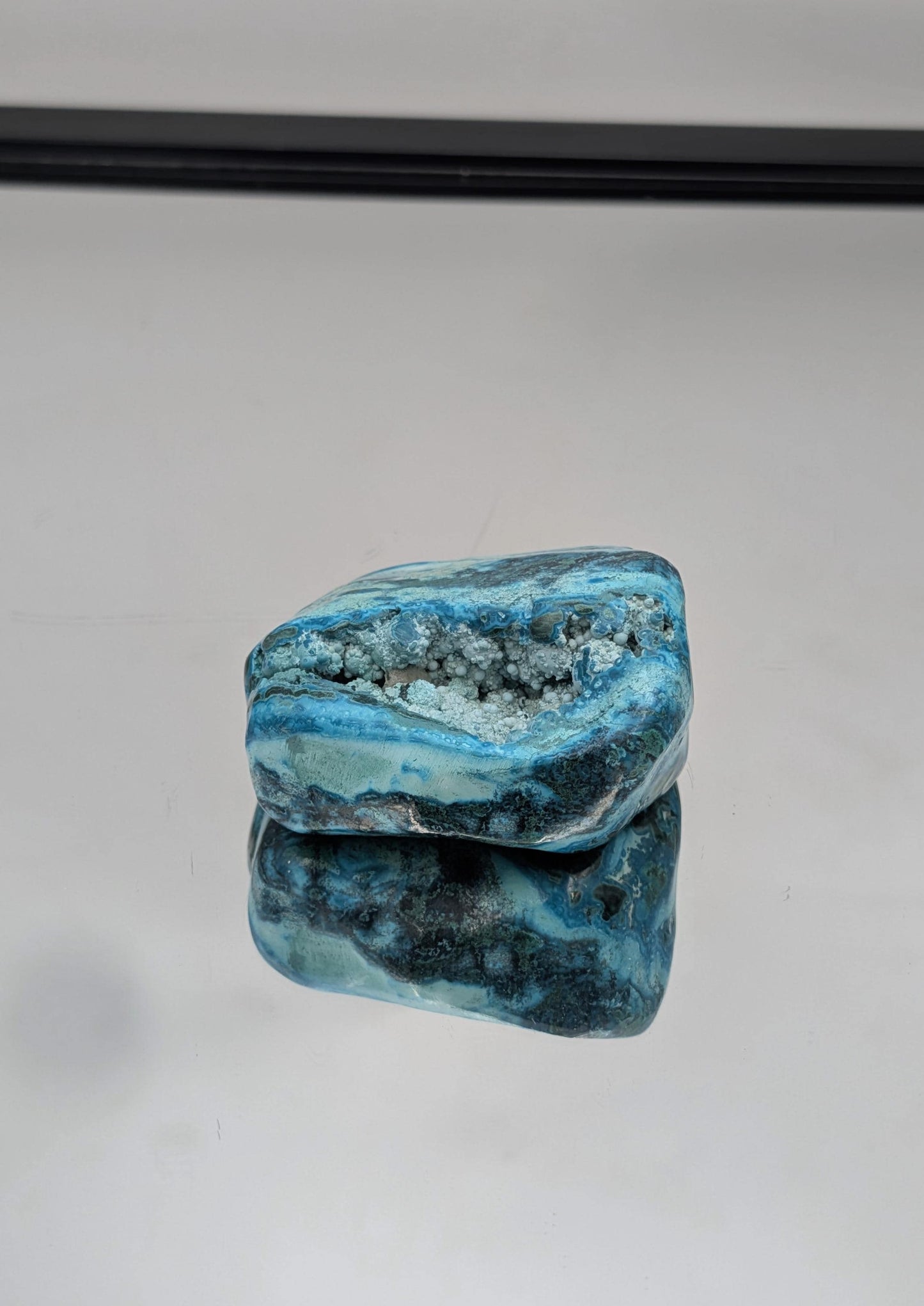 :Large polished Malacolla crystal with vibrant colour and organic shape.