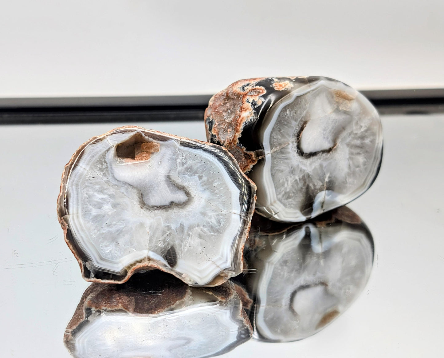 Polished Malawi Agate pair showcasing bold black banding.