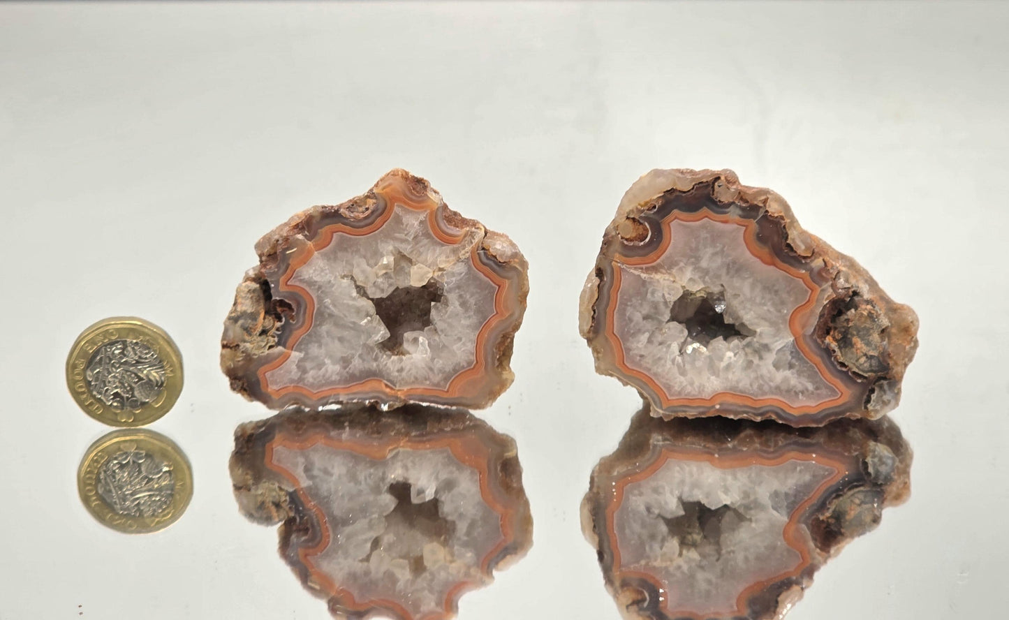 Malawi Agate geode pair with polished faces and banded layers.