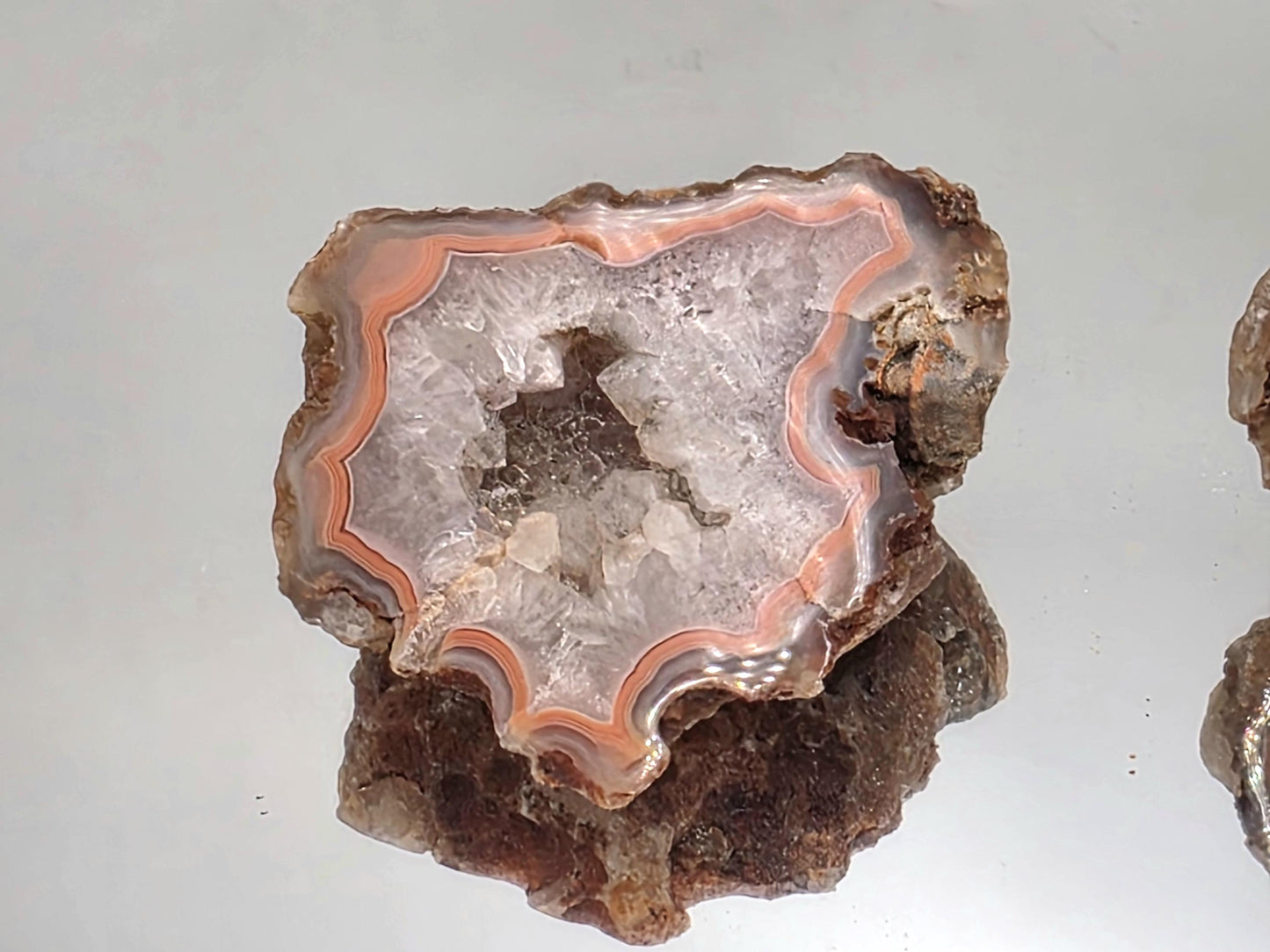 Malawi Agate polished geode pair for display collections.