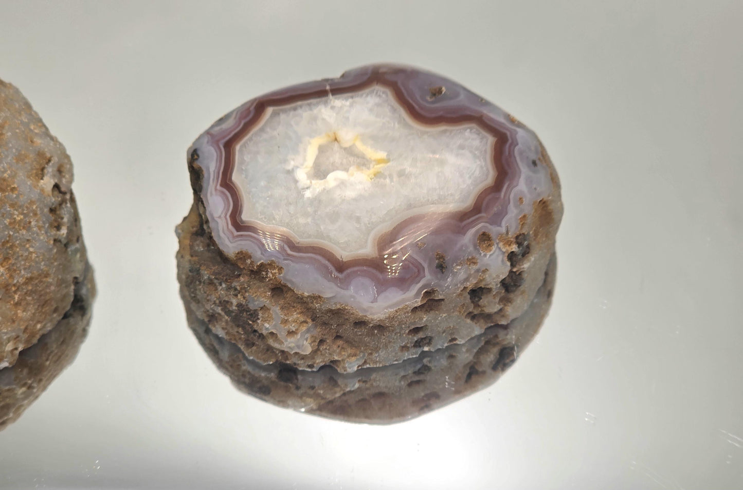 ibrant Malawi Agate polished geode display piece.