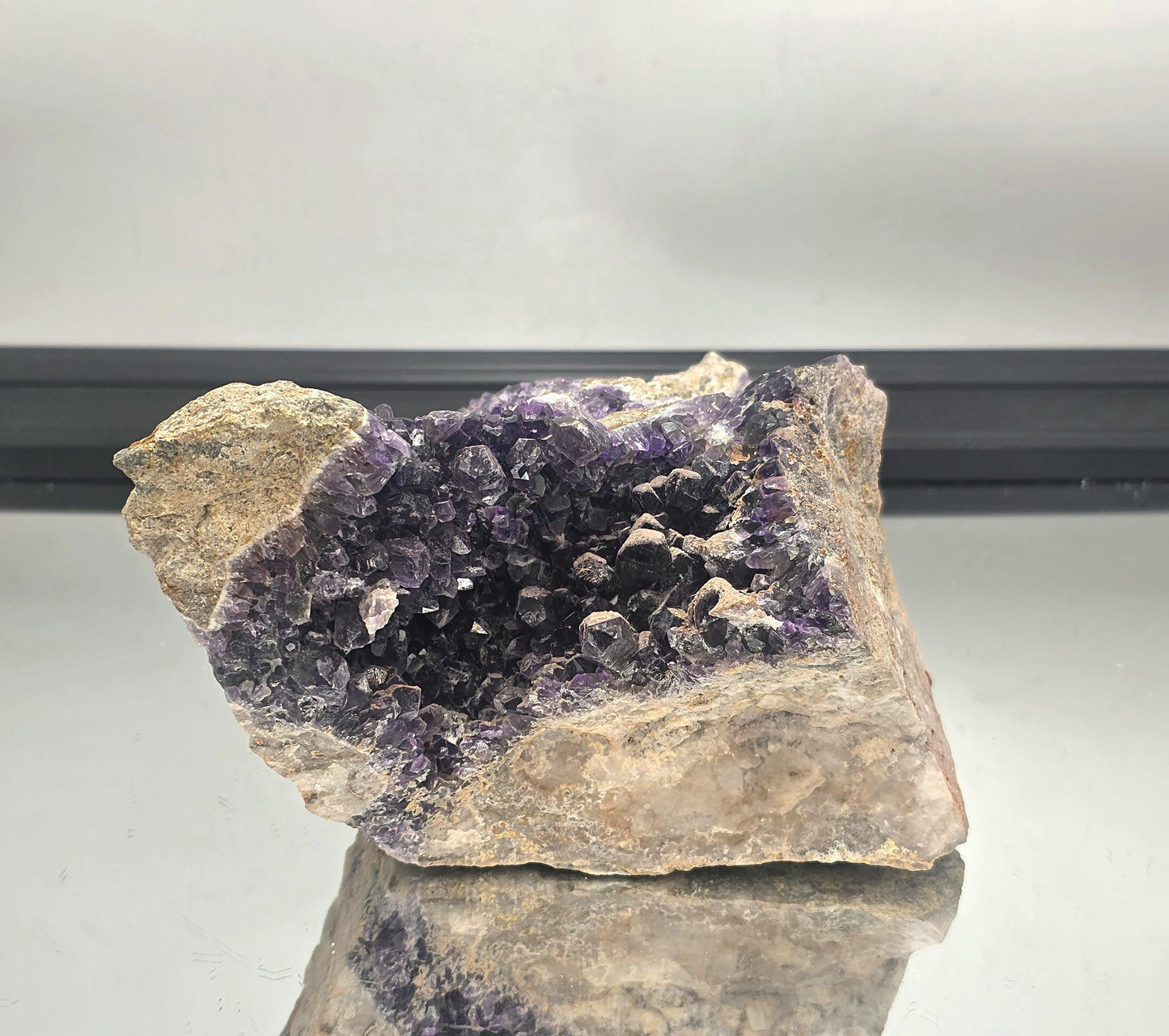 Collector’s Mapatizya amethyst cluster with dark purple hues.
