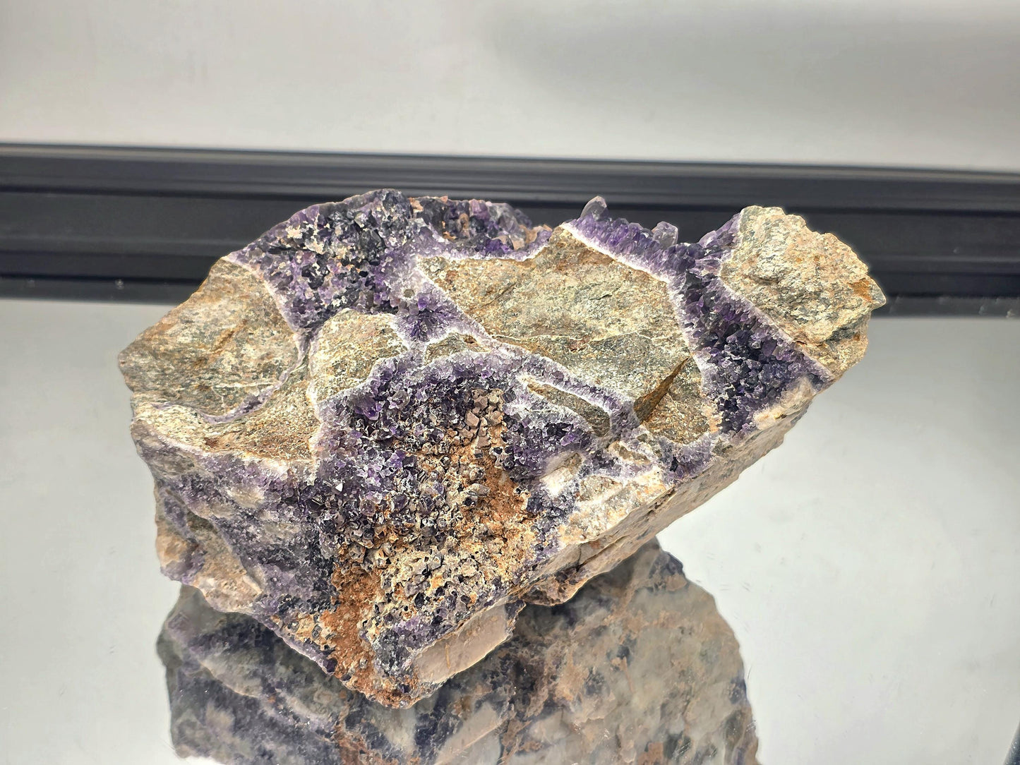 Dark Mapatizya amethyst crystal cluster, natural specimen.