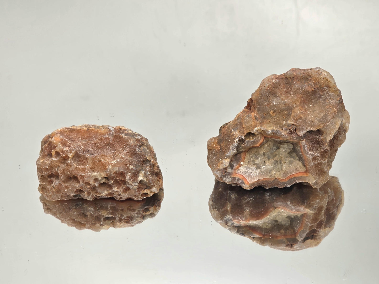Matching Malawi Agate geode pair with polished edges.