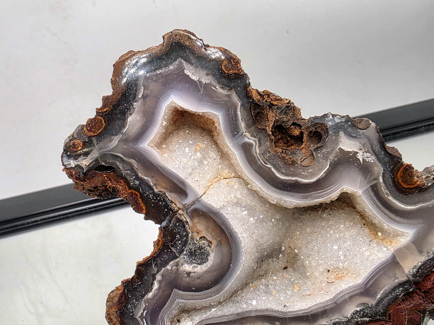 Polished Mexican Agate Geode gemstone suitable for display.
