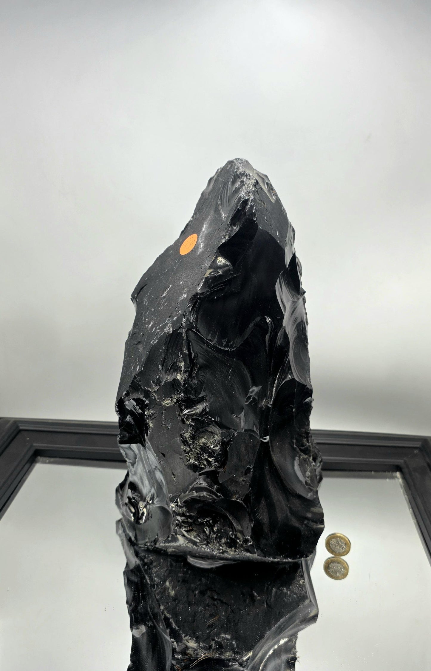 Minimal decor scene with bold raw obsidian as the centerpiece.