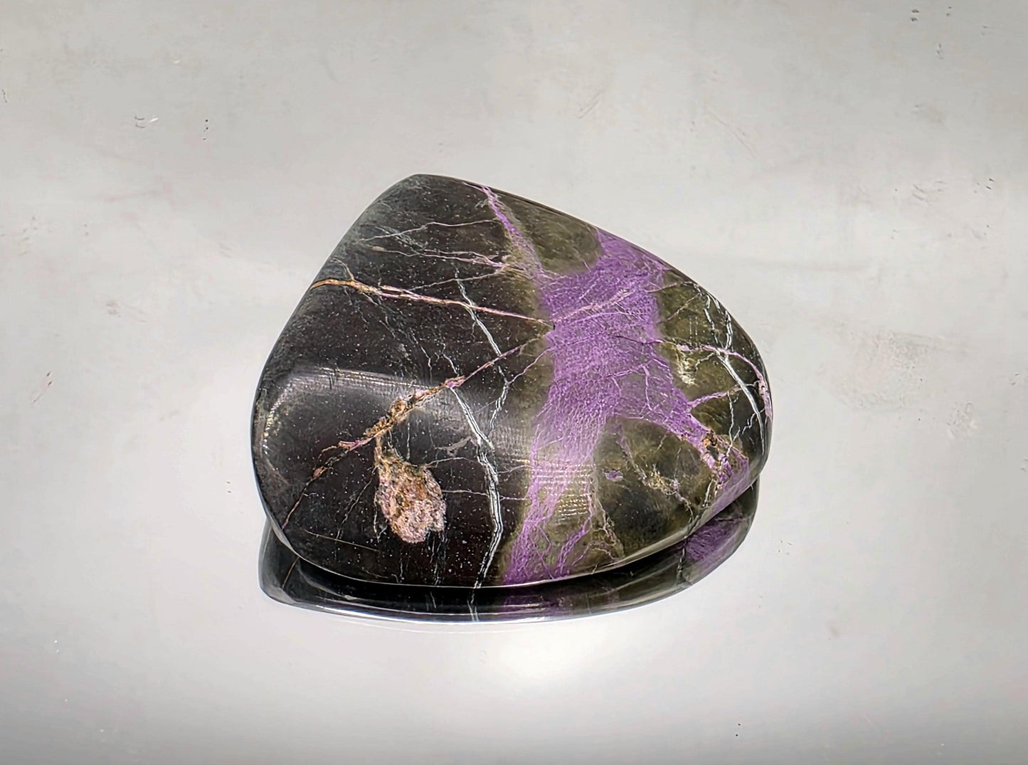 Unique mineral specimen made of stichtite and serpentine.