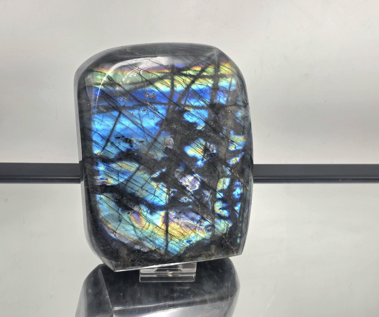 Natural Large Labradorite Crystal Freeform with vibrant flash, polished to enhance its striking appearance.