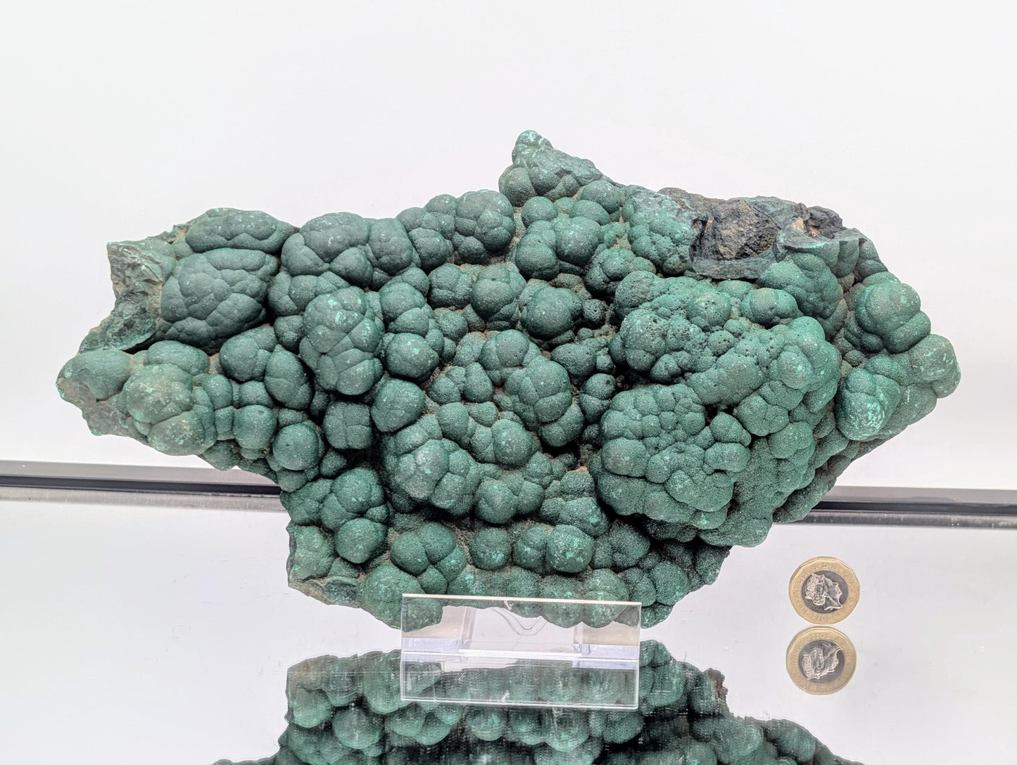 Authentic malachite crystal showcasing quartz druzy features.