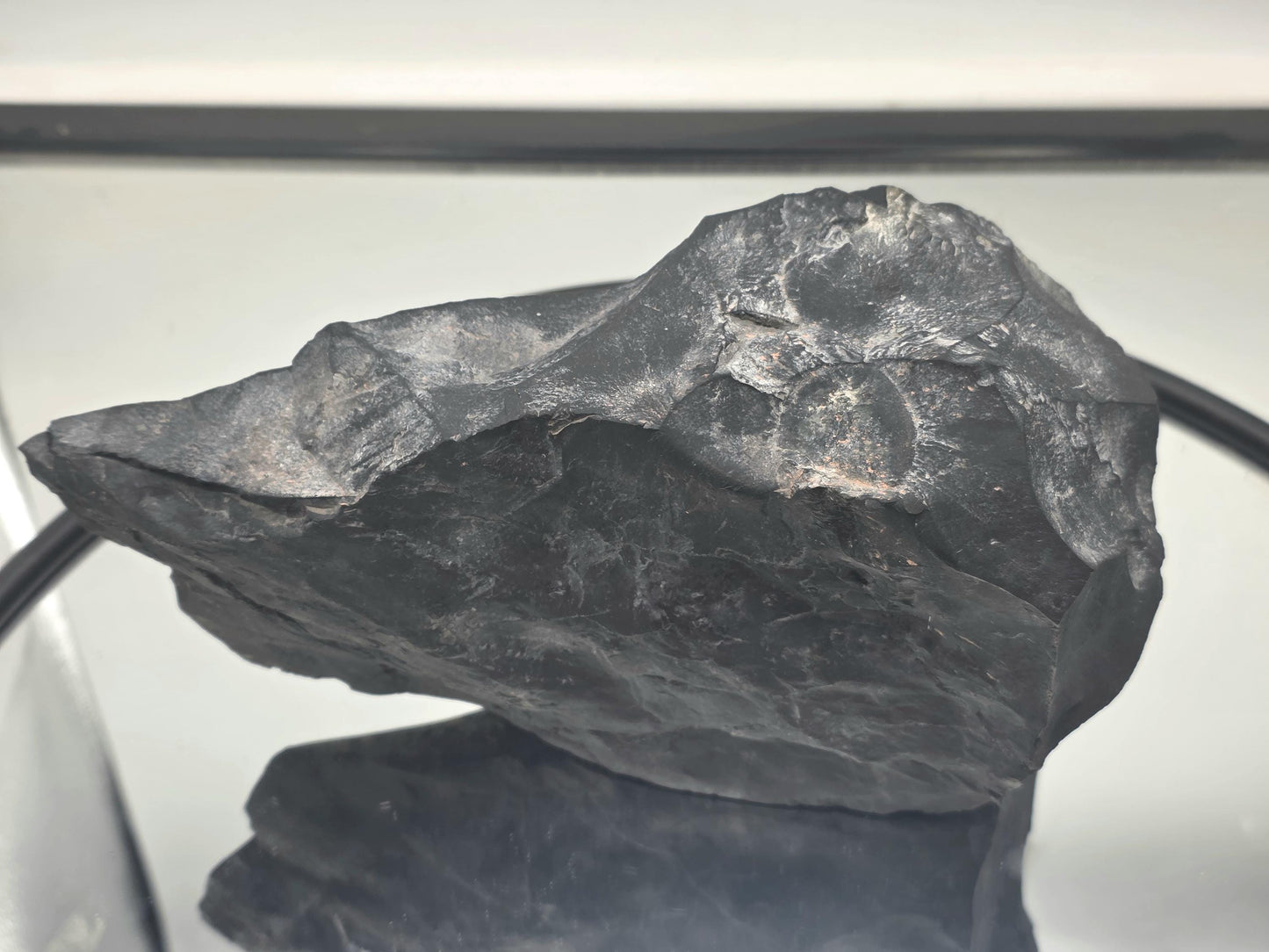 Authentic shungite piece showcasing natural pyrite formations within.