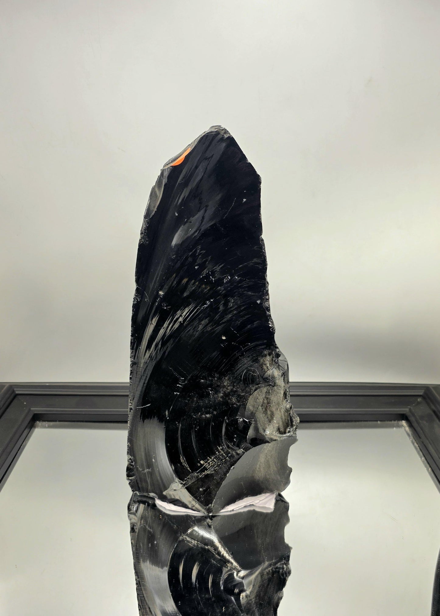 Sculptural natural obsidian in a neutral-toned living room.