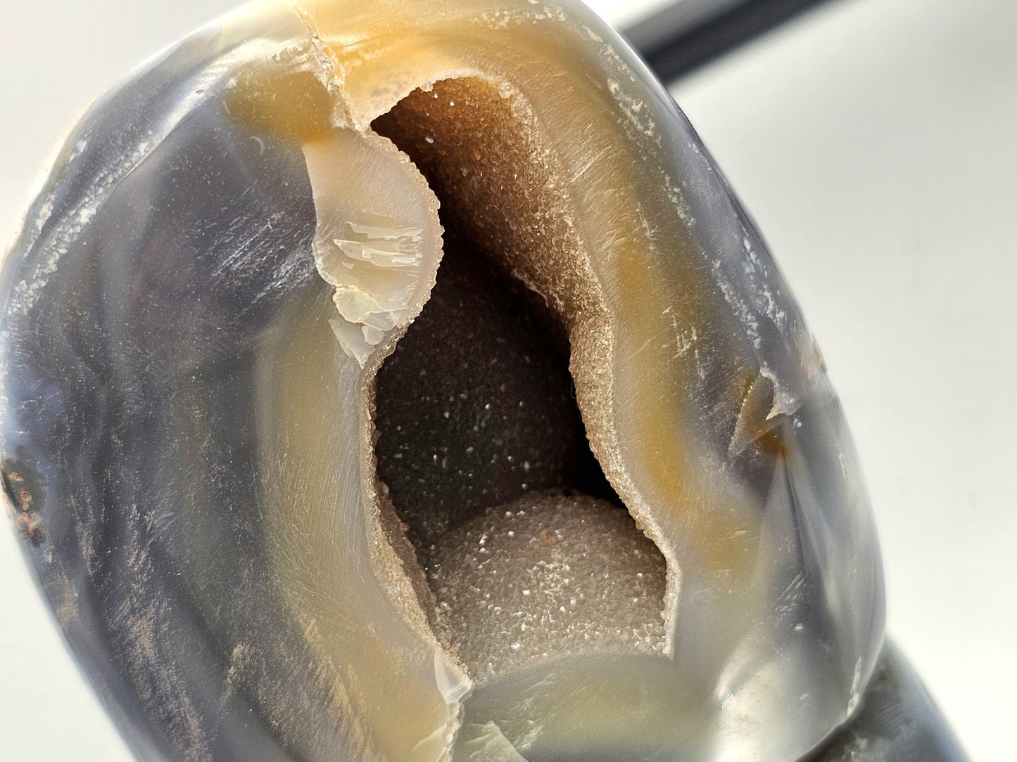 Display of Blue & White Agate (Orca Agate) crystal freeform with its unique hollow and elegant design.