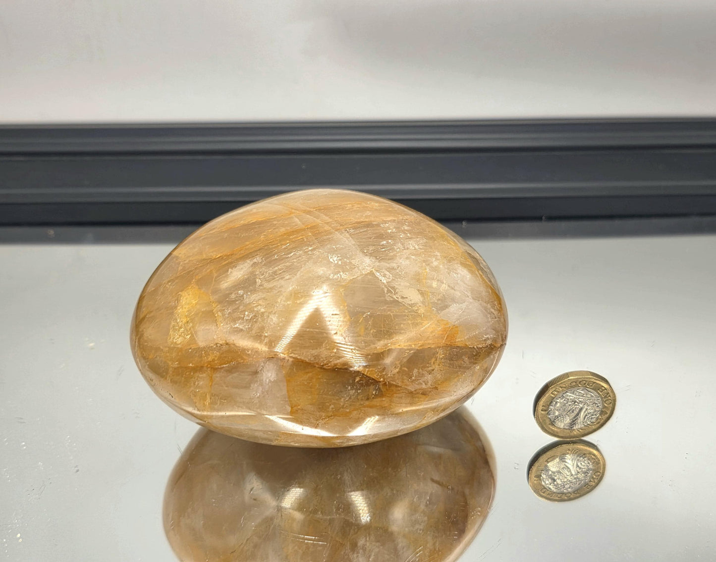 Oversized palmstone in golden quartz