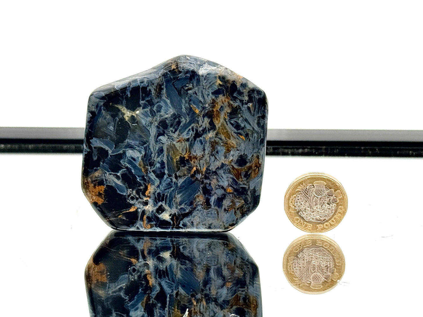 Natural pietersite slice showing swirling colours