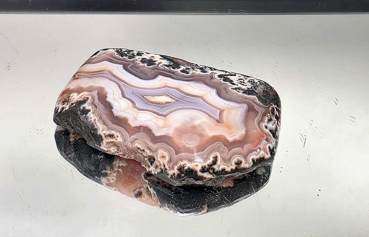 Polished agate crystal slice from Morocco, perfect for décor.
