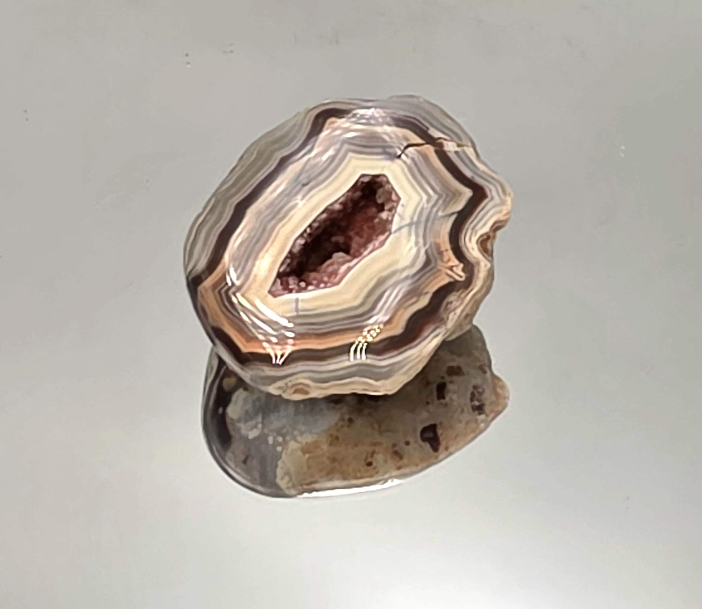Polished Malawi Agate geode pair with banded layers.