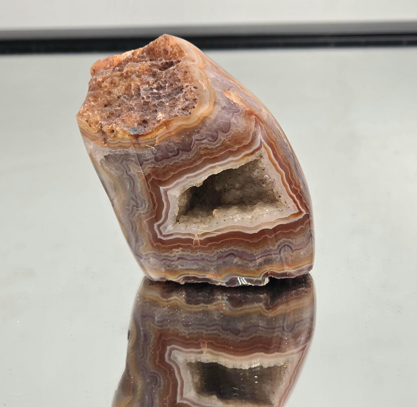 Polished Malawi Agate crystal geode for collectors.
