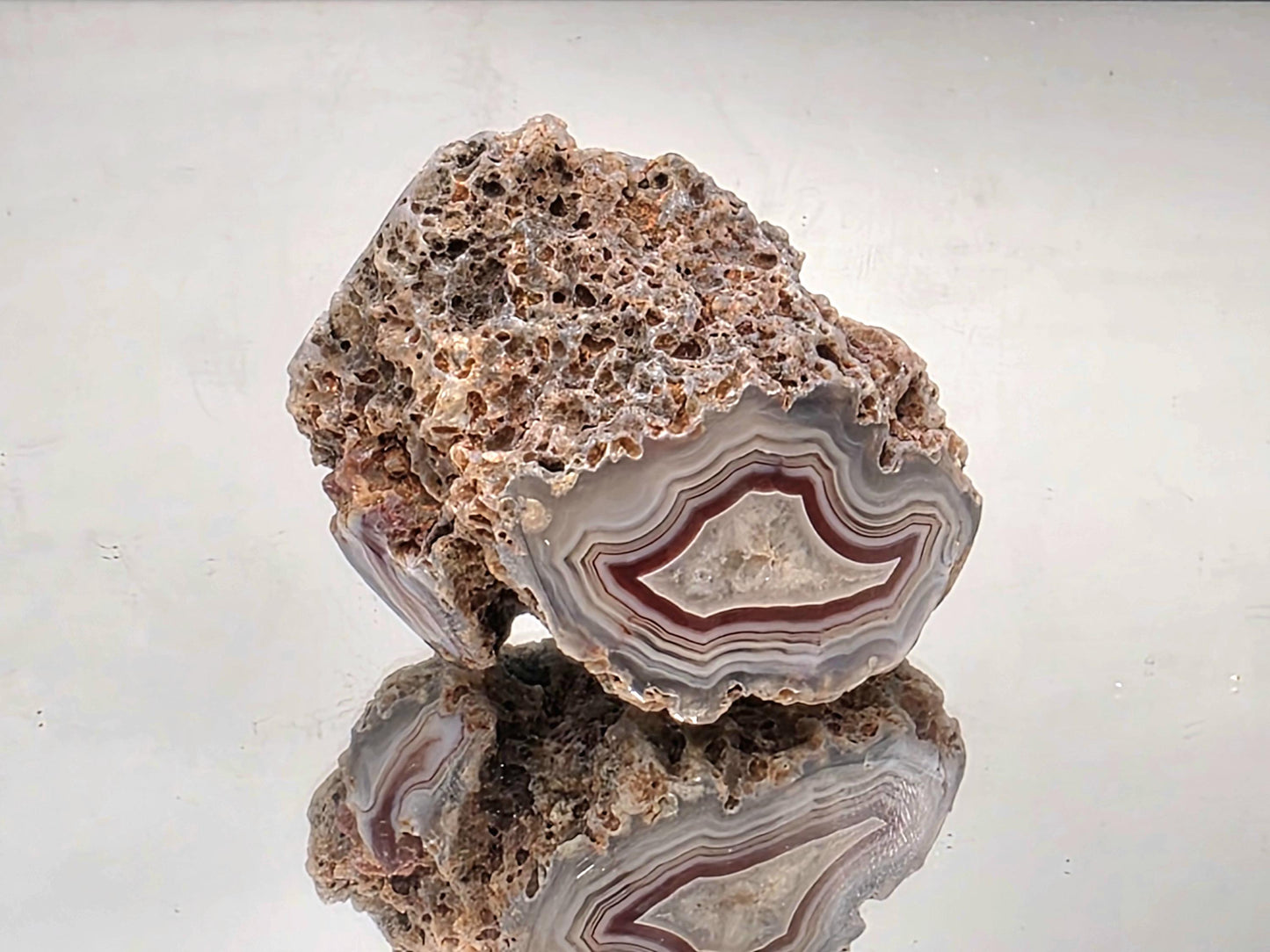 Polished Malawi Agate crystal geode with colour banding.