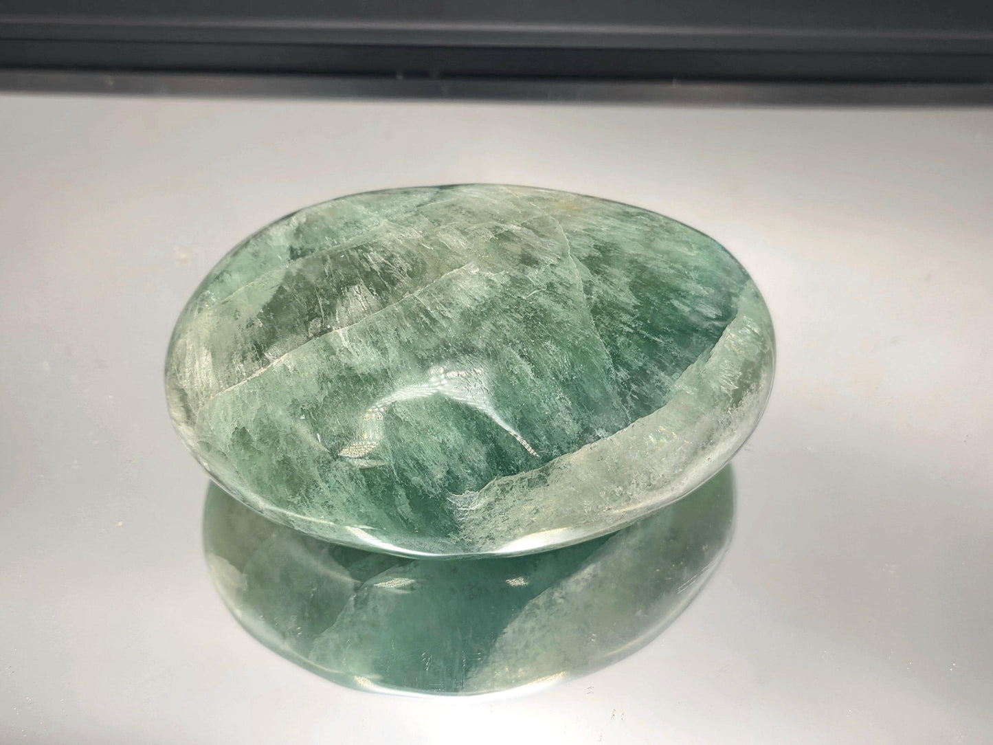Polished fluorite massage crystal tool