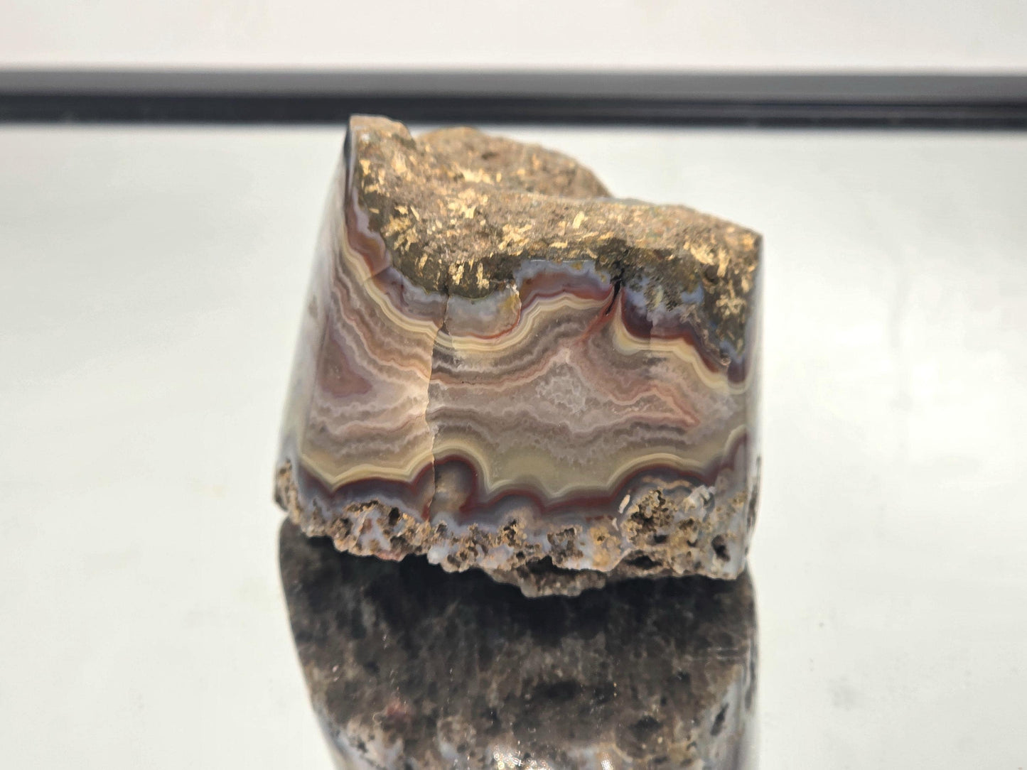 Polished large Malawi Agate crystal geode.