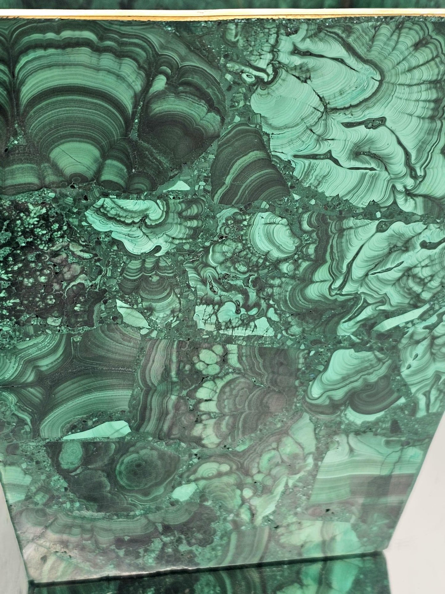 Handcrafted malachite pot with vibrant green bands and polished finish