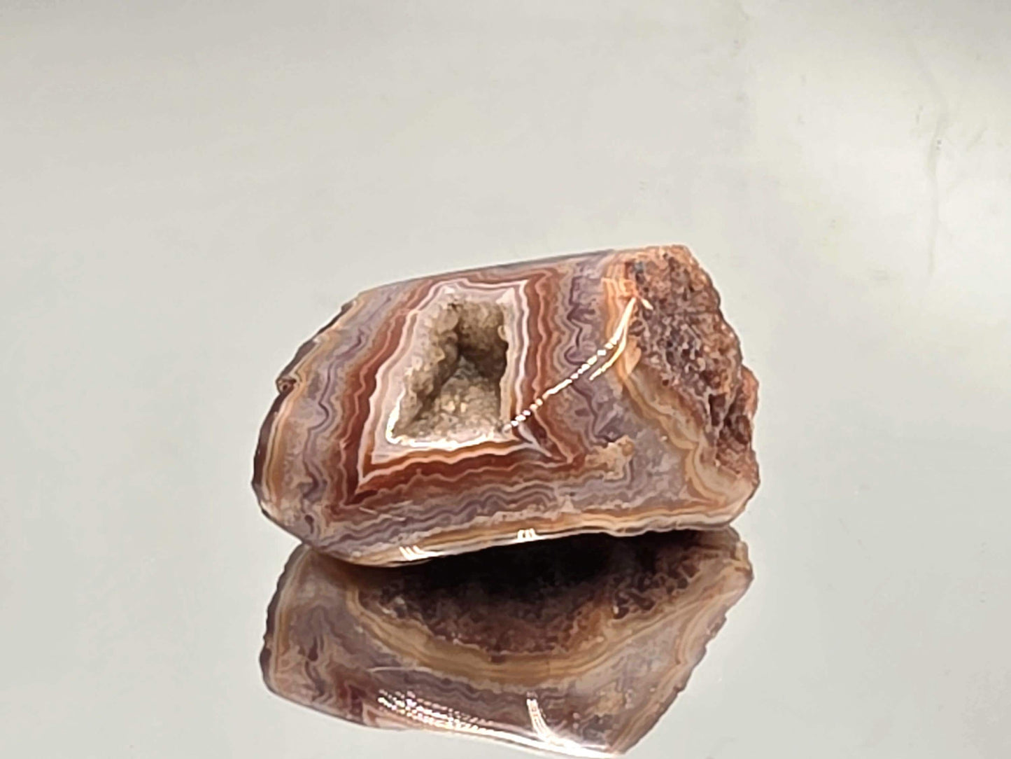 Polished Malawi Agate slice showing earthy layered tones.