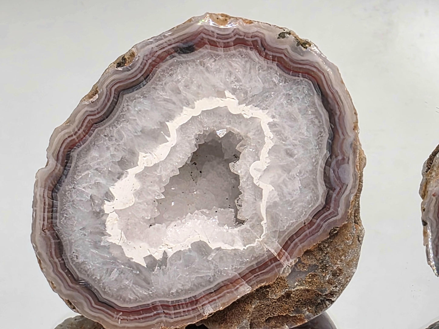 Polished Malawi Agate geode with vibrant banding.