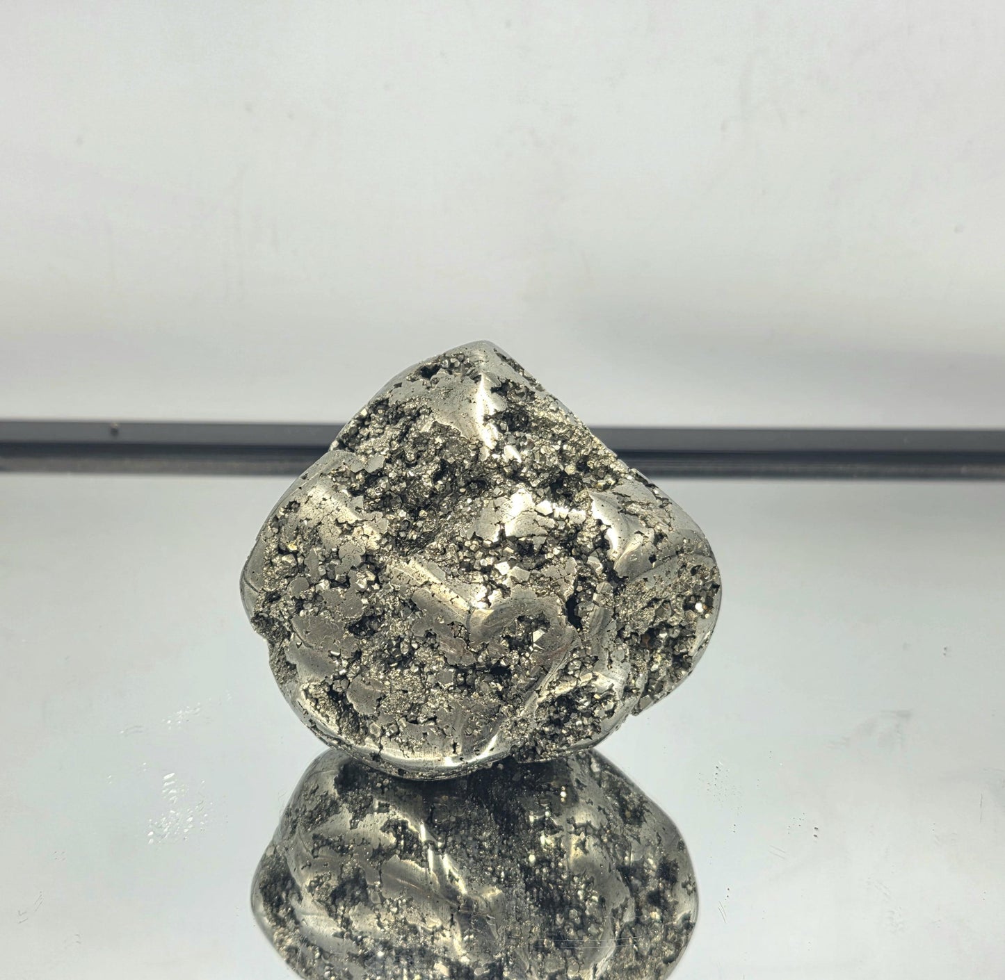 A polished Pyrite Crystal Freeform, ideal for display.