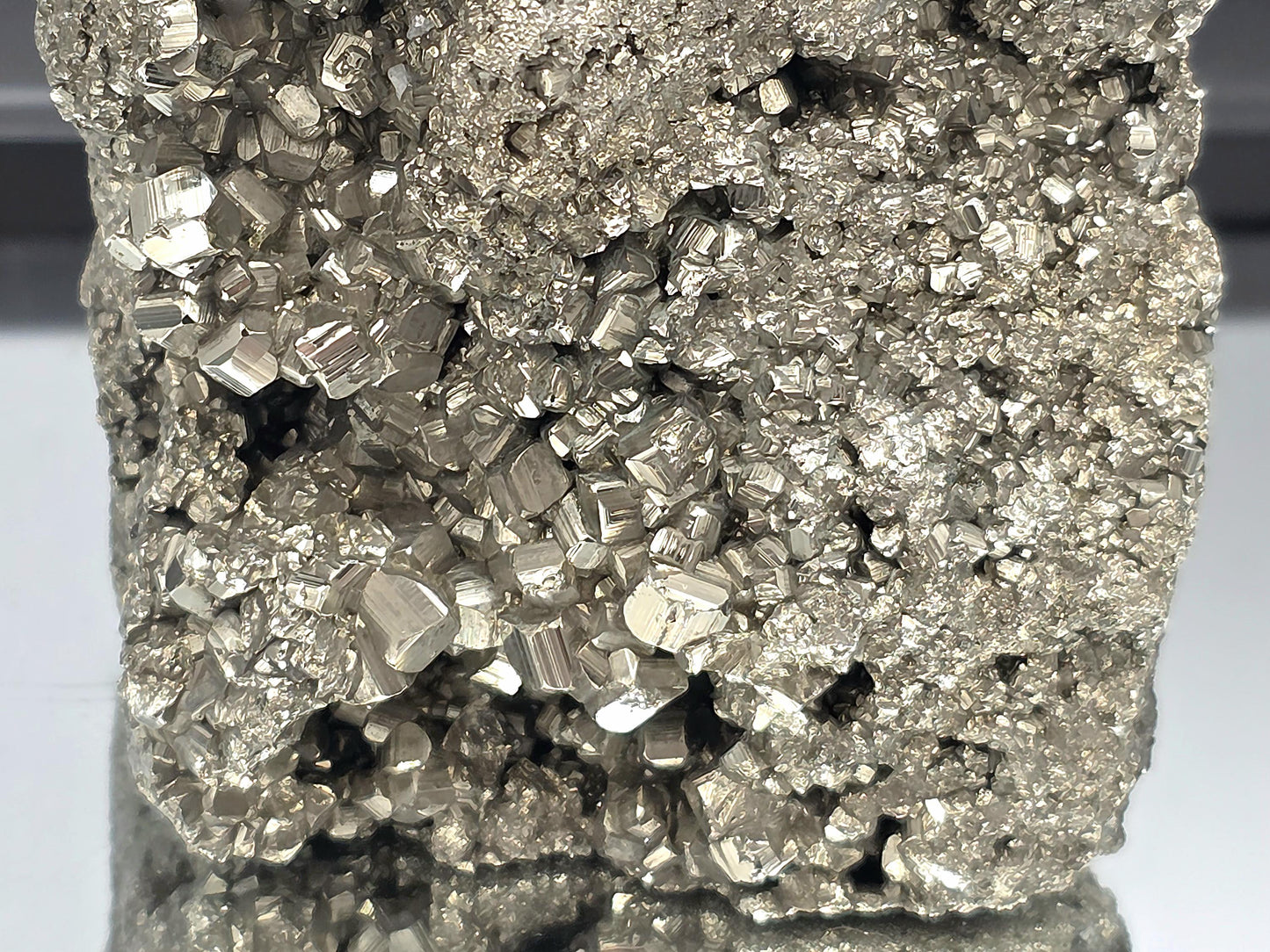 Natural pyrite structure with a sleek, polished finish.