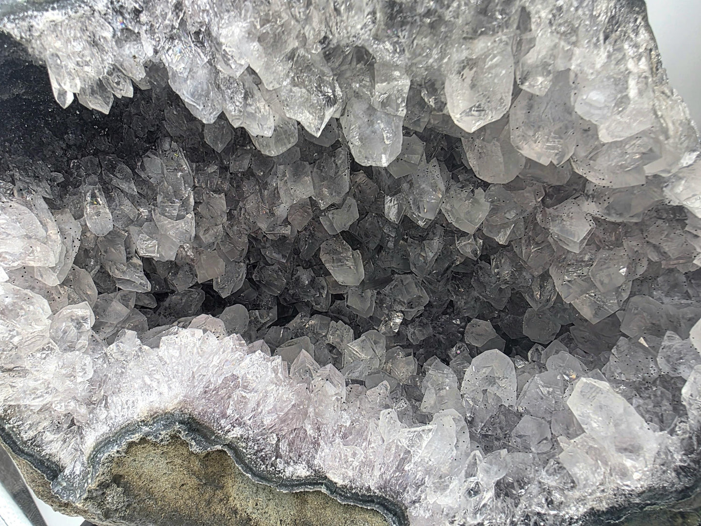 Quartz crystal geode featuring sparkling formations.