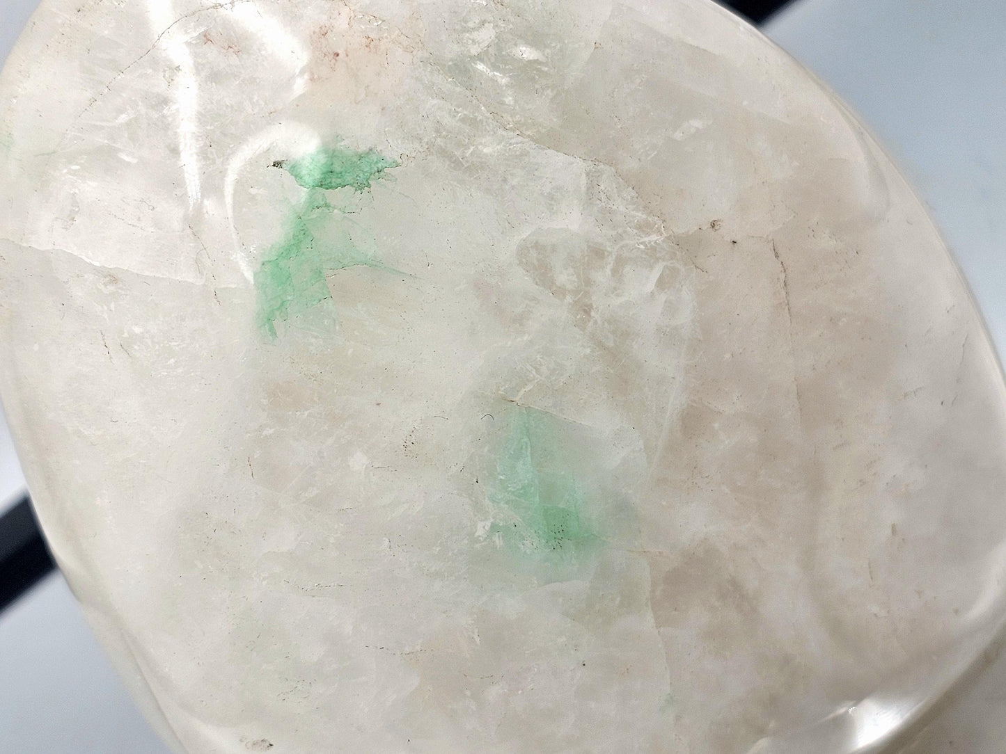lose-up of Quartz crystal featuring Green Fuchsite inclusions, highlighting the natural patterns and visual effects.