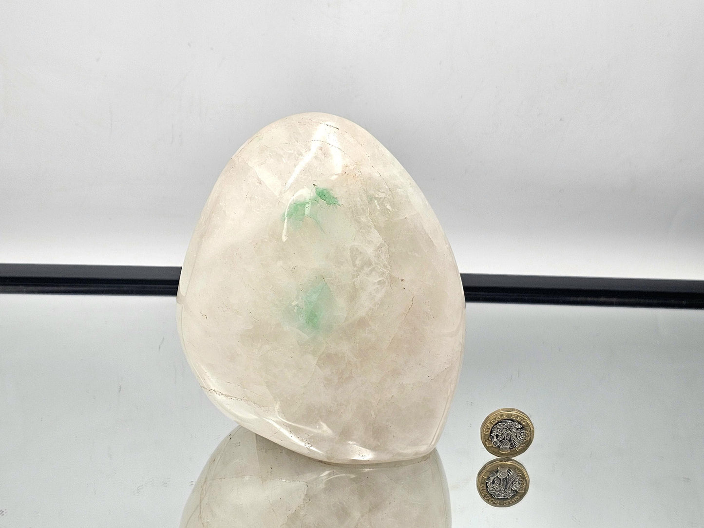 Quartz crystal with Green Fuchsite inclusion, illuminated to reveal the natural beauty of the crystal and inclusions.