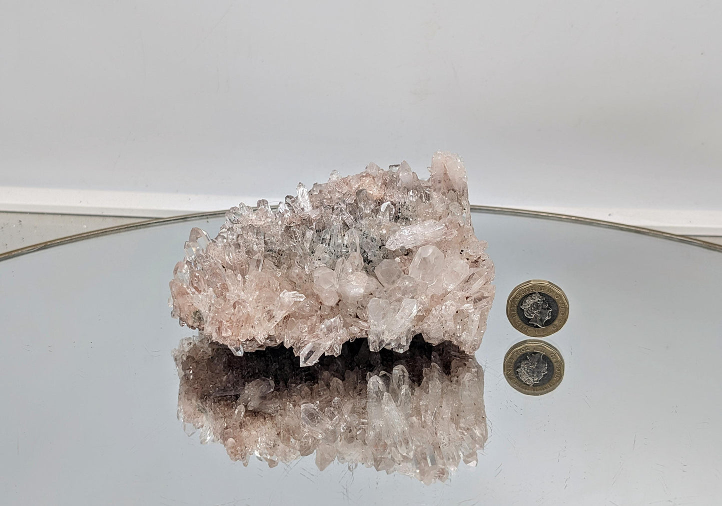 A rare large pink Colombian clear quartz crystal cluster, perfect for collectors and decor.