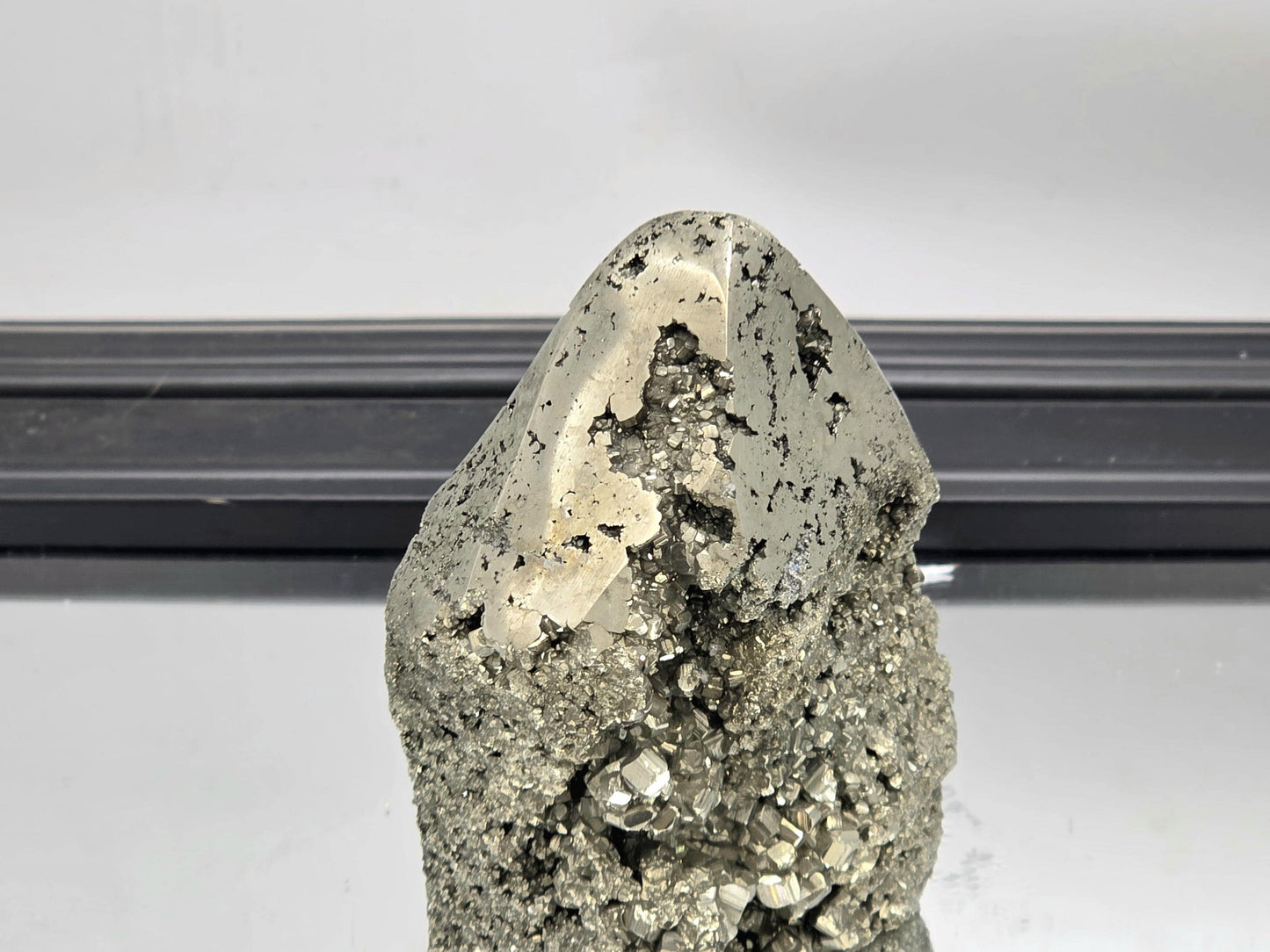 Pyrite tower blending raw texture with smooth crystal polish.