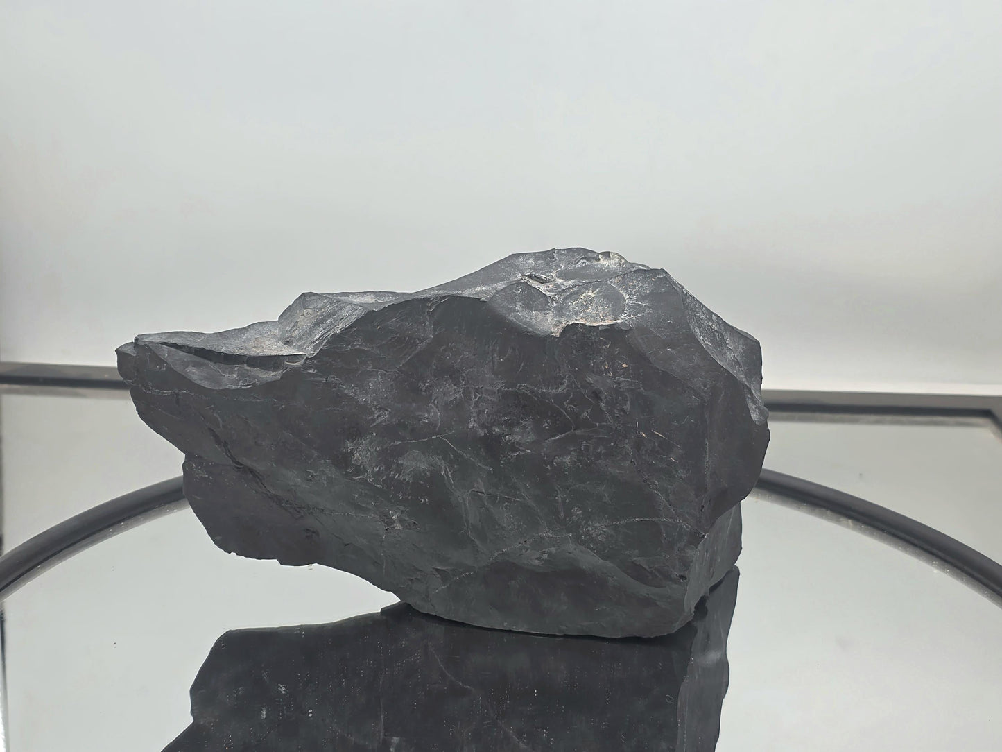 Decorative shungite piece with natural and polished surfaces.
