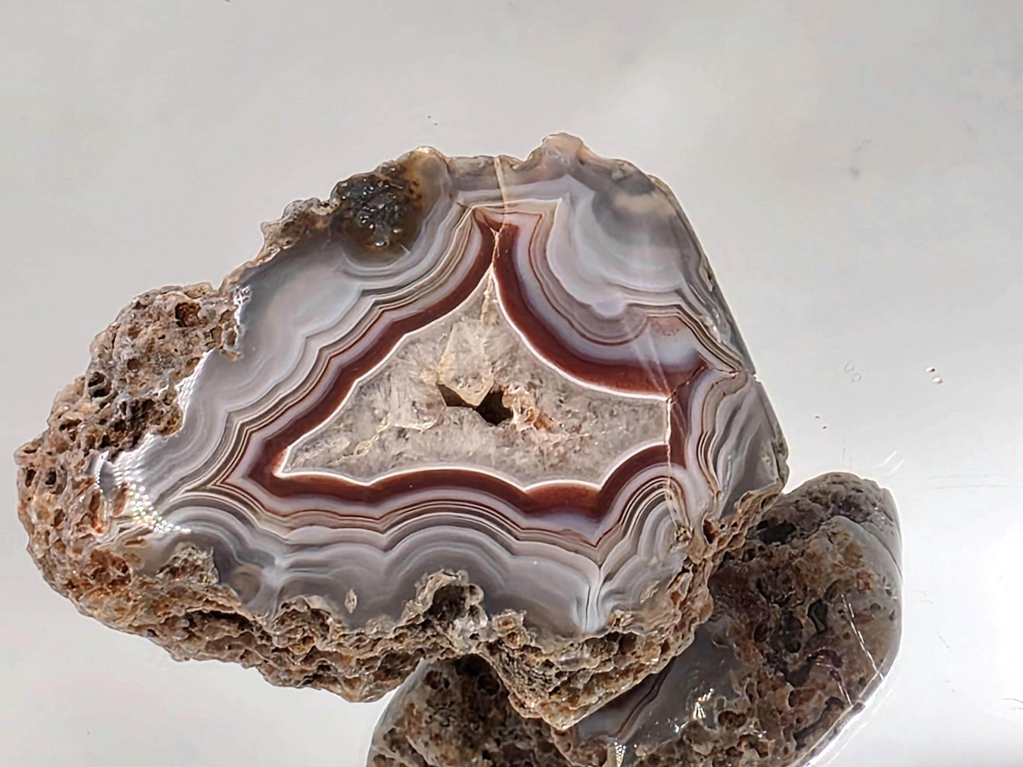 Unique Malawi Agate polished geode with layered banding.