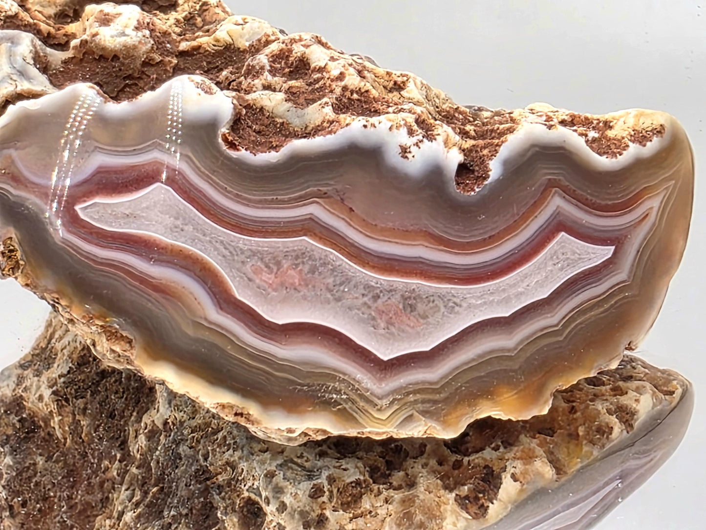 Unique polished Malawi Agate geode rock with banding.