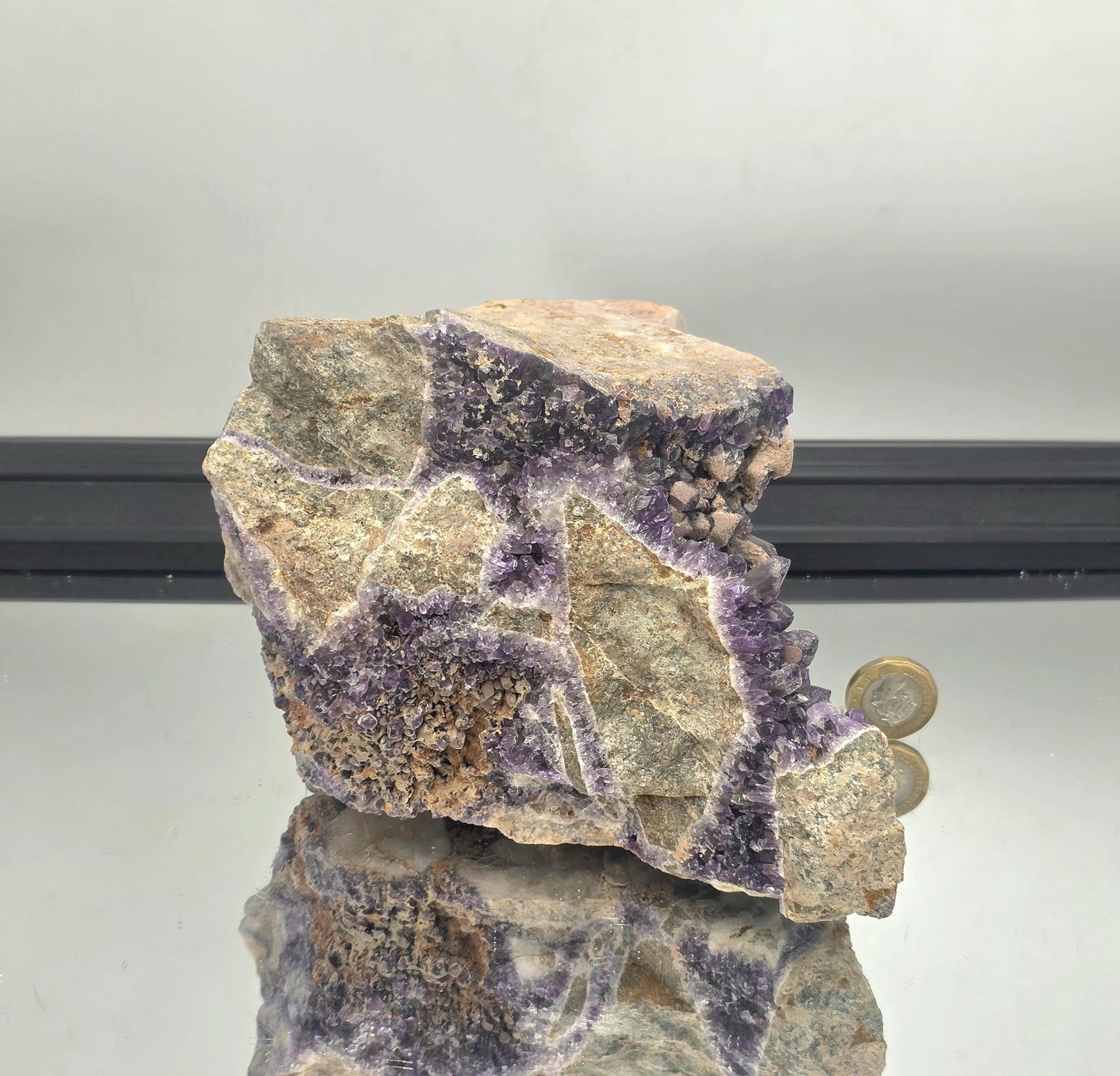 Dark violet Mapatizya amethyst cluster specimen.