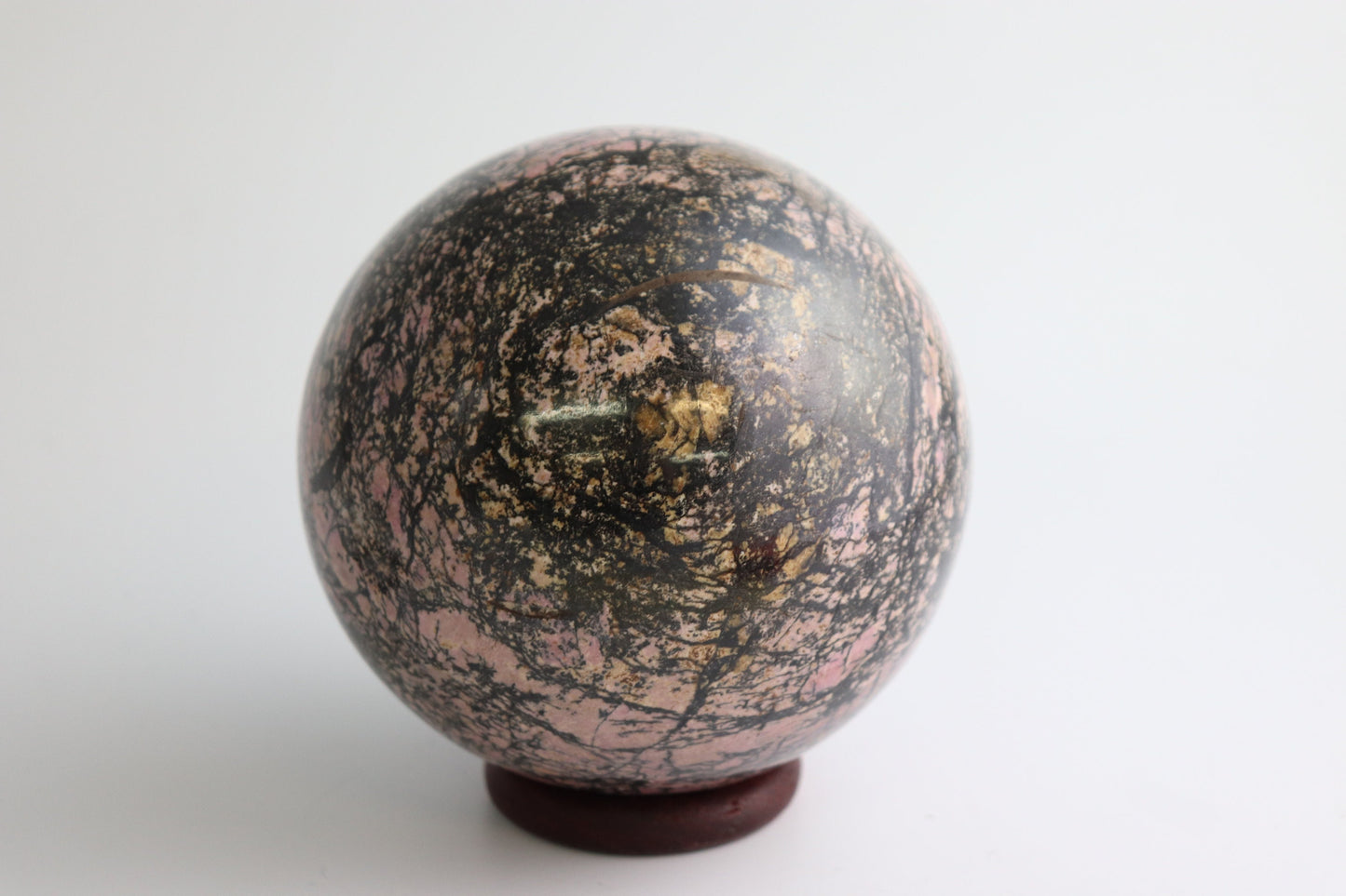 50) Large Rhodonite Crystal Sphere 2.29KG