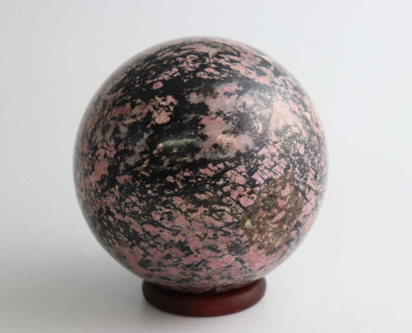 50) Large Rhodonite Crystal Sphere 2.29KG