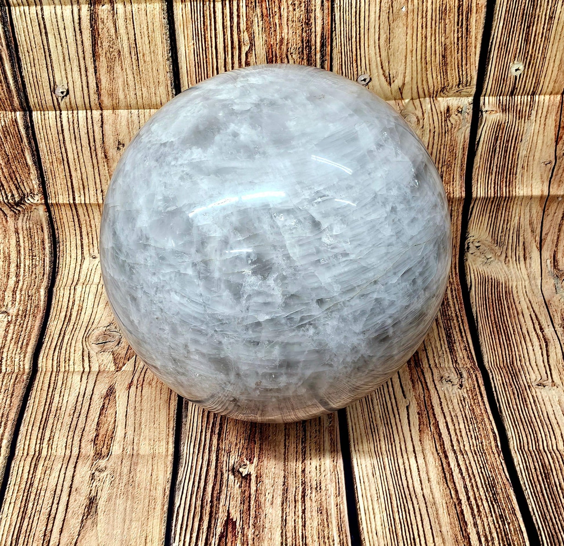 128kg natural quartz sphere on a wooden stand for home or office decoration