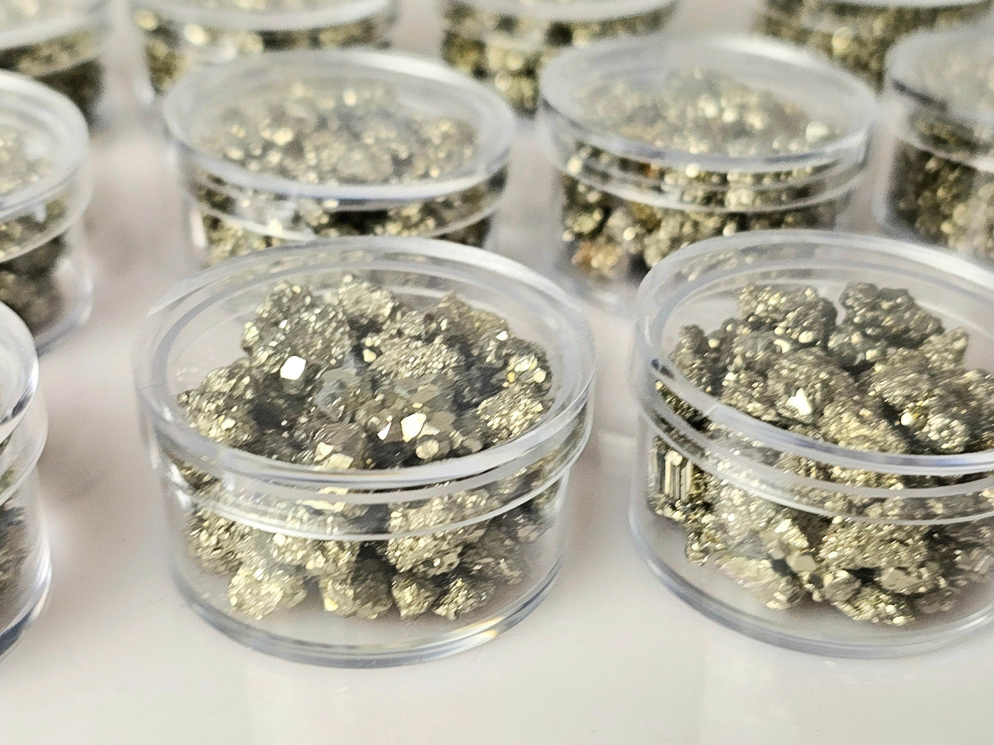 Pyrite crystals in display case