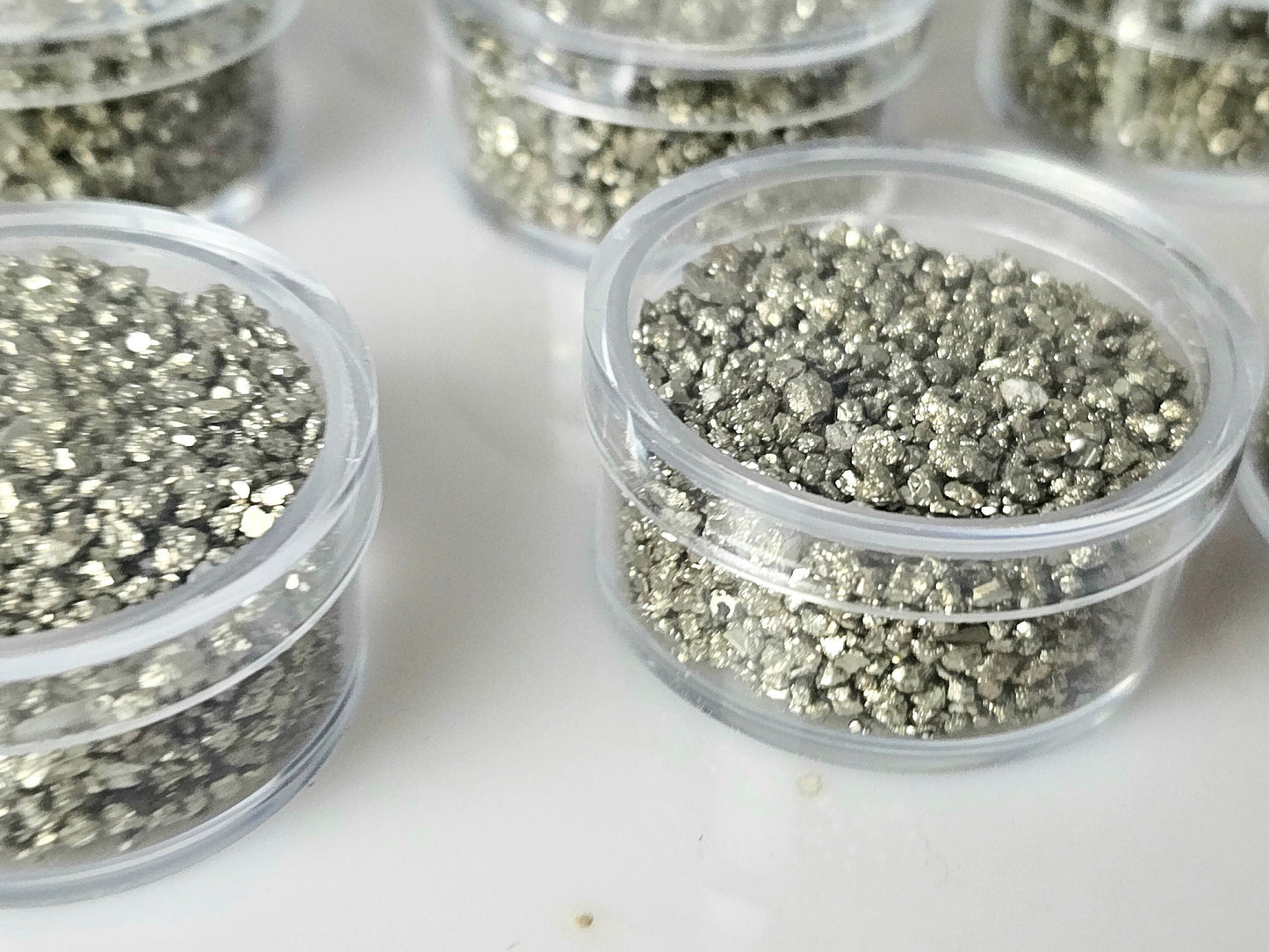 Pyrite crystals in display case