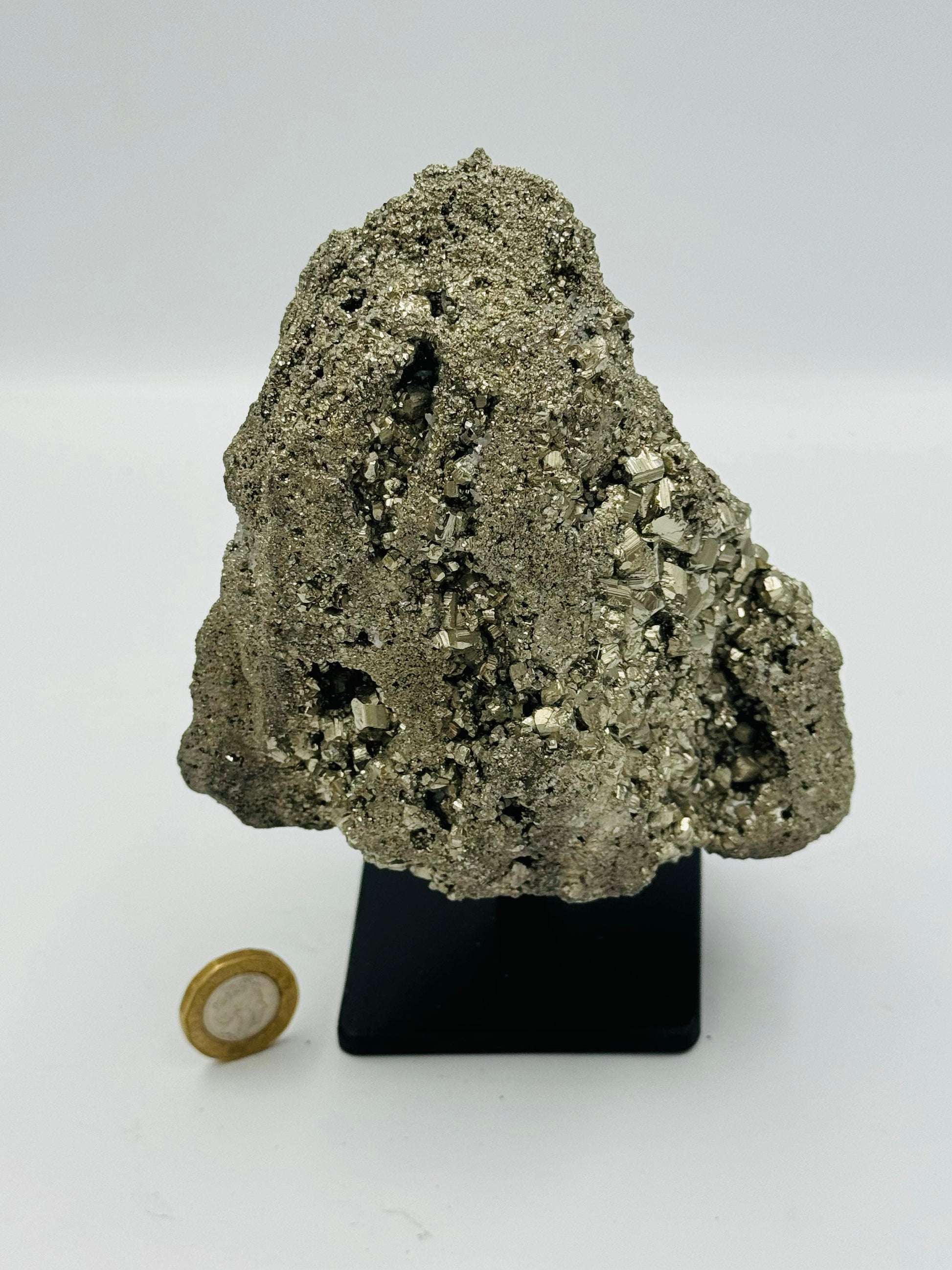 big pyrite on display stand