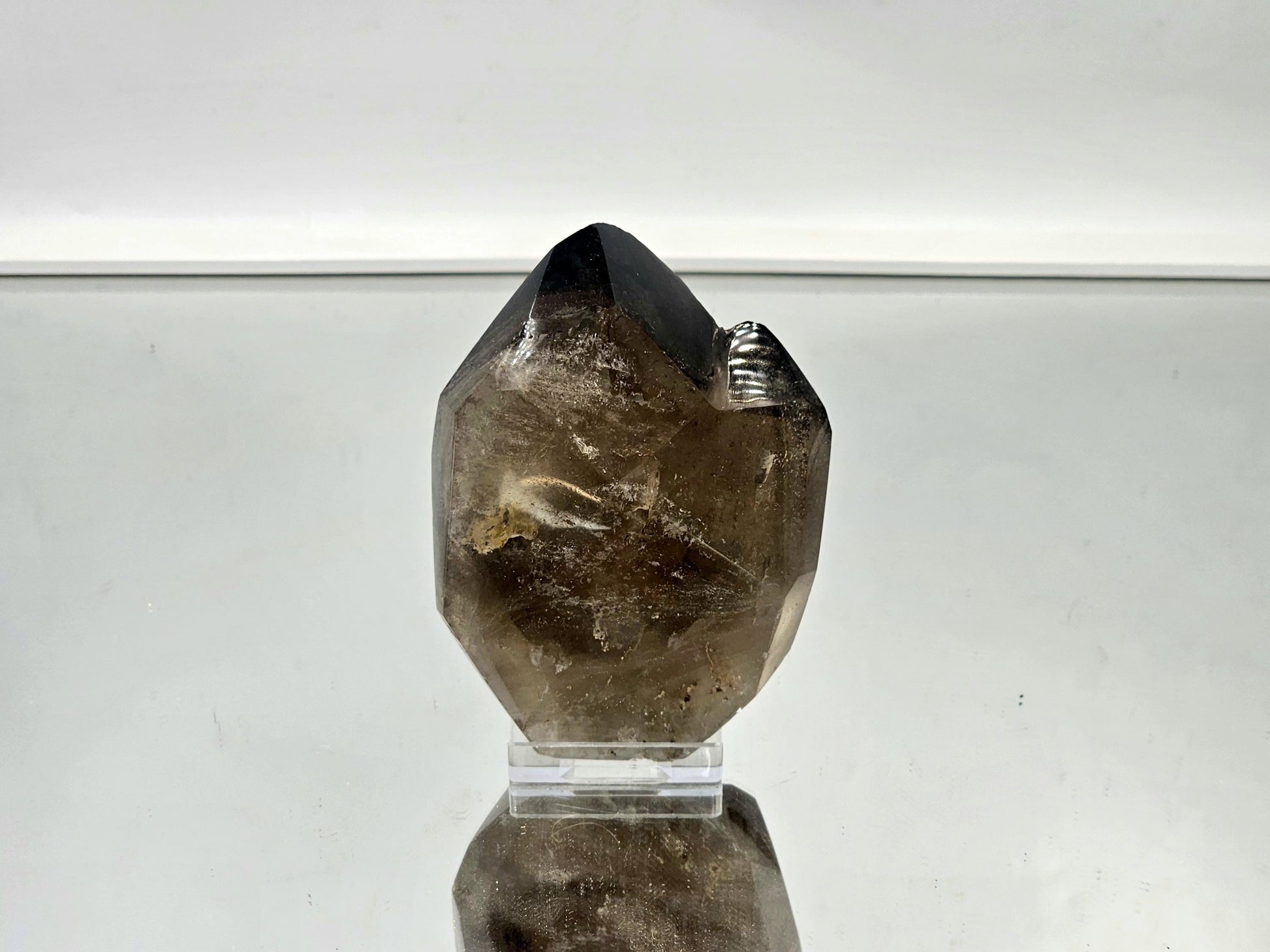 Large smoky quartz crystal as a bold accent piece in a modern interior