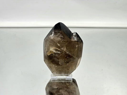 Large smoky quartz crystal as a bold accent piece in a modern interior